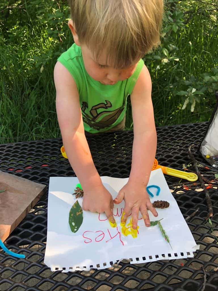 camping tradition for kids, making a sign for your campsite!