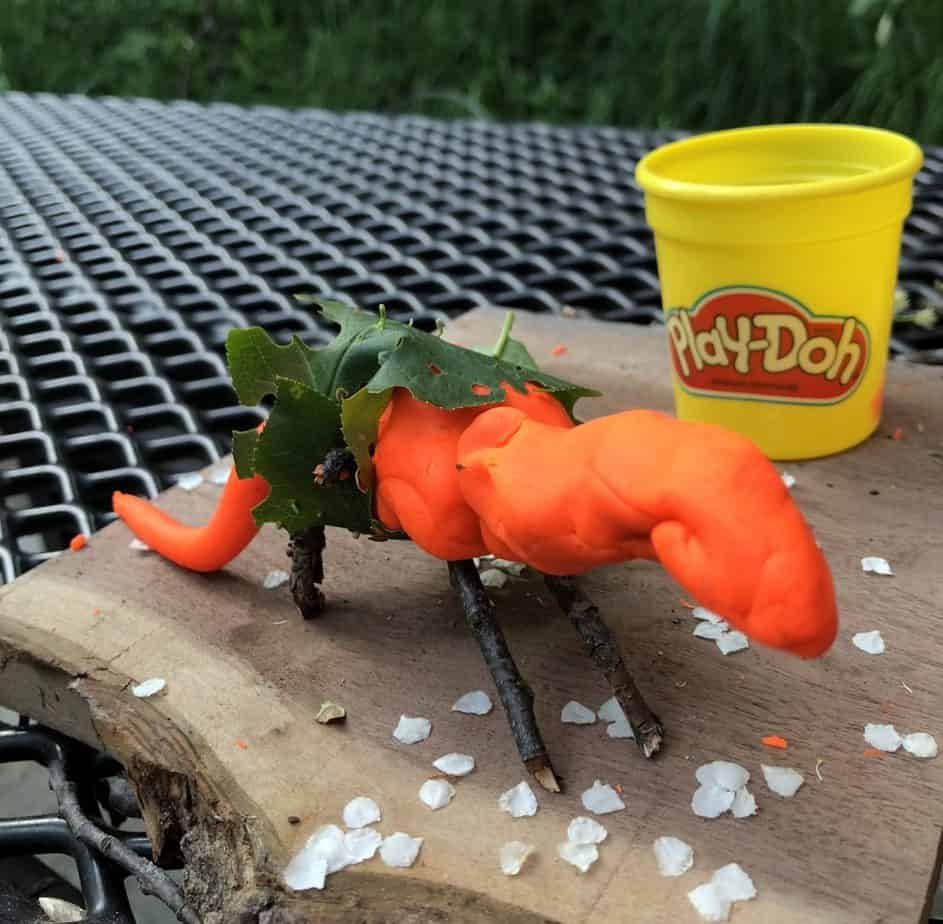 playdoh craft idea using items found in nature to make a dino