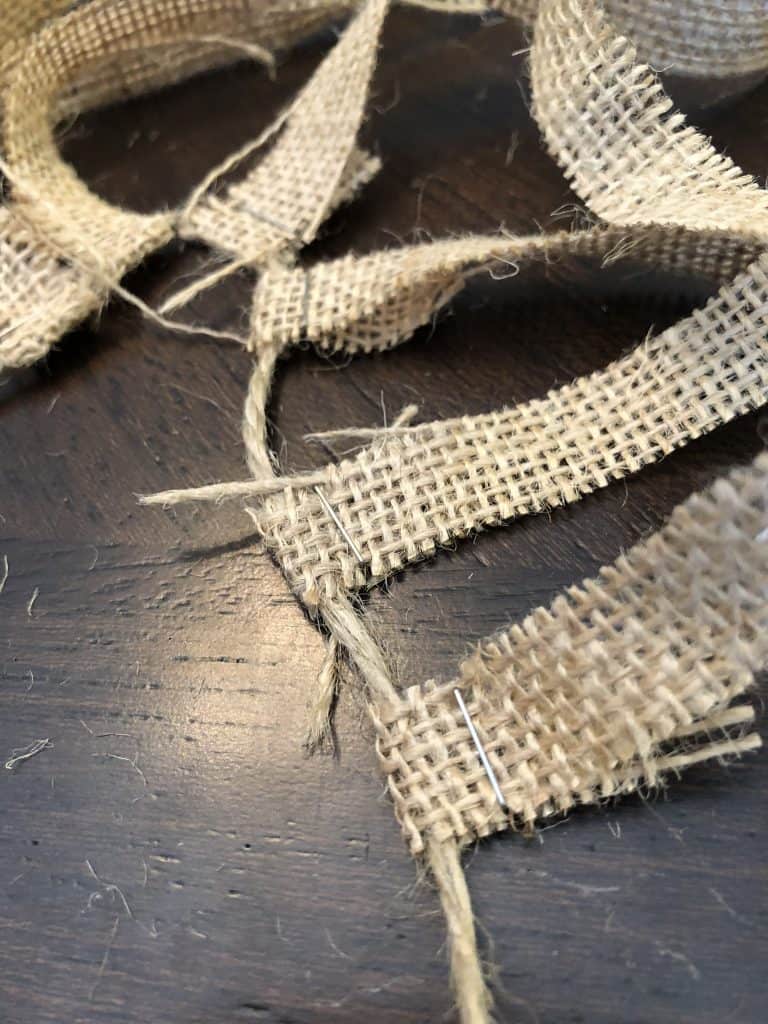 burlap being attached to highchair banner