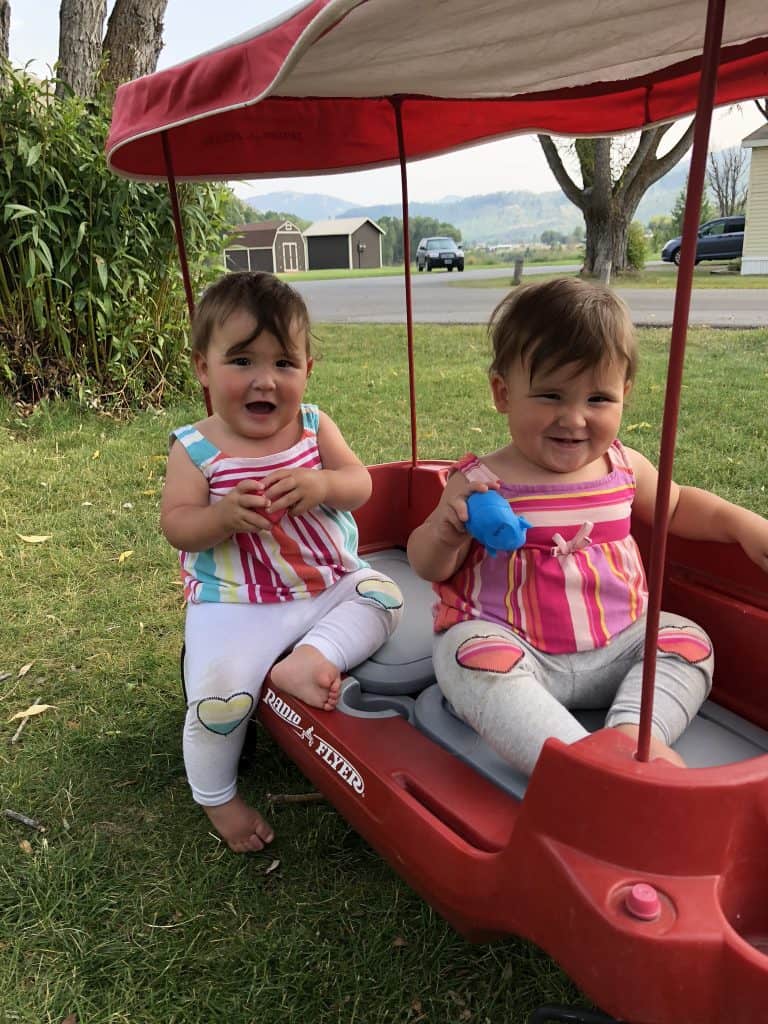 twin girls in wagon