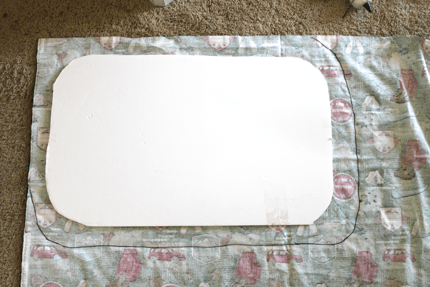 trace around foam board to leave enough material to glue on other side for camper windows