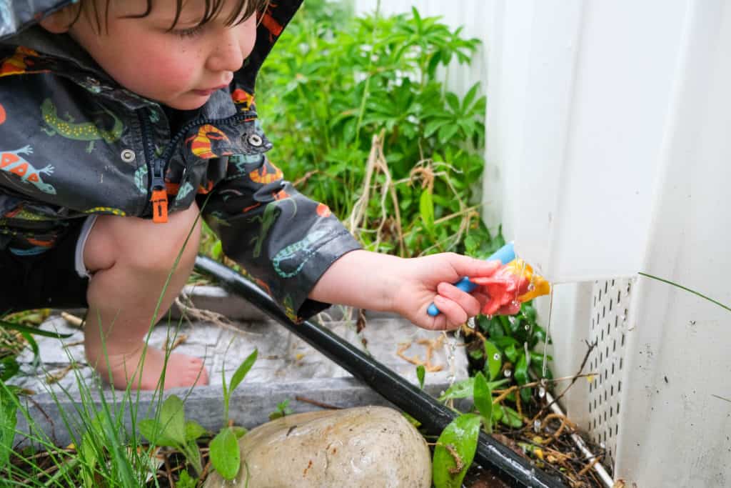 wash off dirty toys with rain for rainy day activity outside