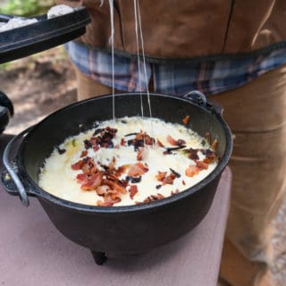 dutch oven cheese dip at camp with jalapeno and bacon