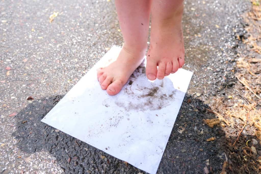 make muddy footprints in rain on paper for rain outdoor activity