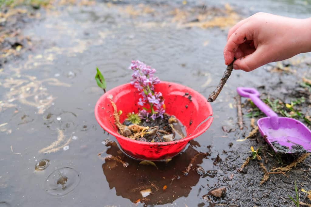 makea mud pie with kids during rain