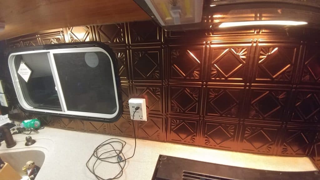 copper backsplash idea for camper kitchen area