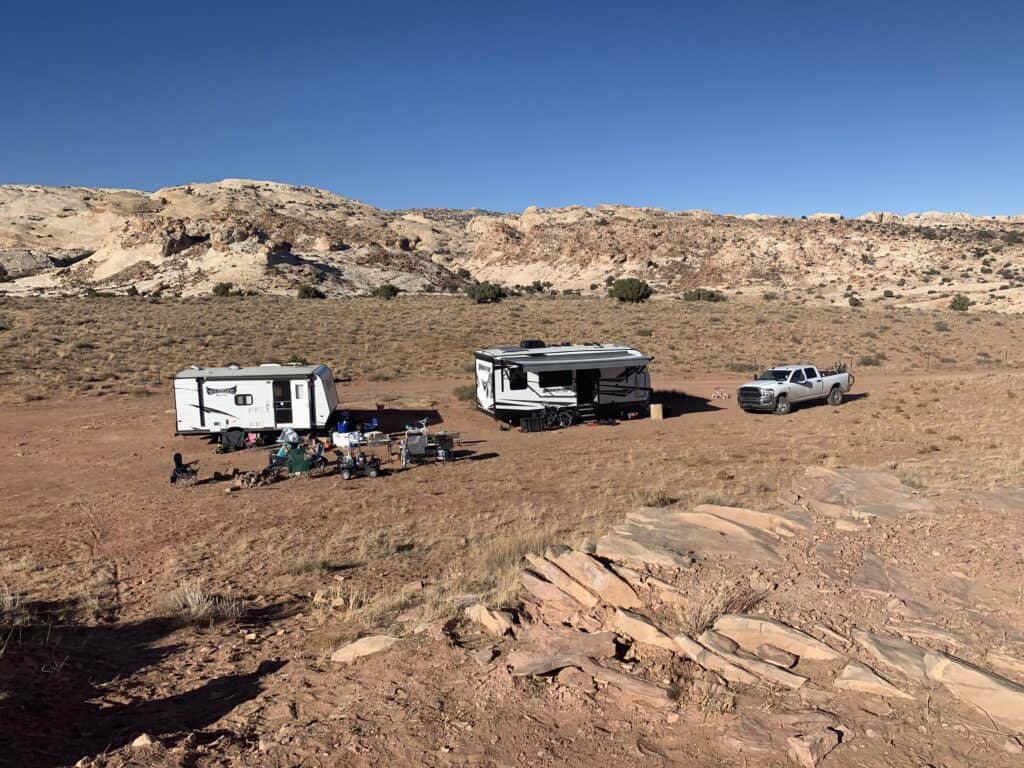 camping in the desert with two campers