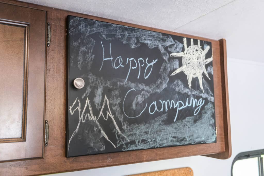 how to cover up mistakes in camper (AC removal, conversion to storage with chalkboard front)
