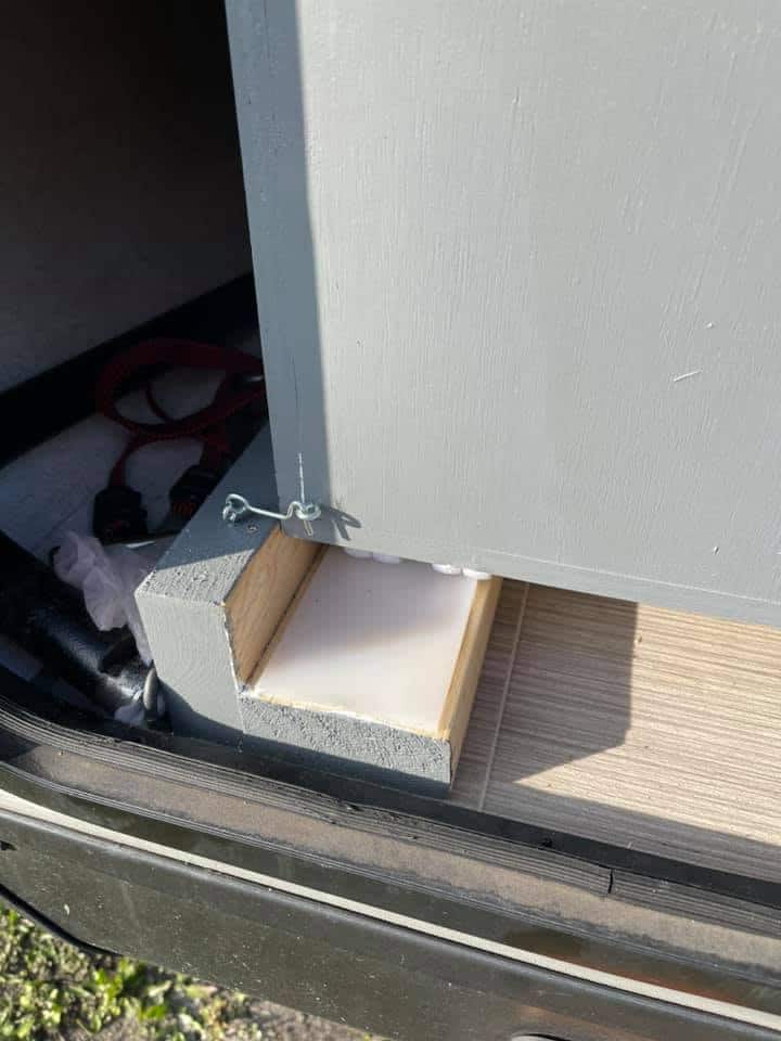 hook to hold bin in place while travling in camper