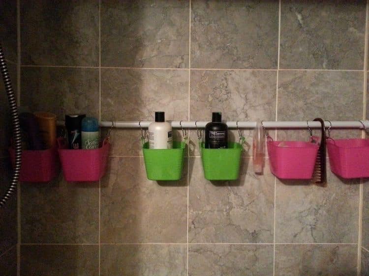 hanging plastic baskets in rv shower to organize