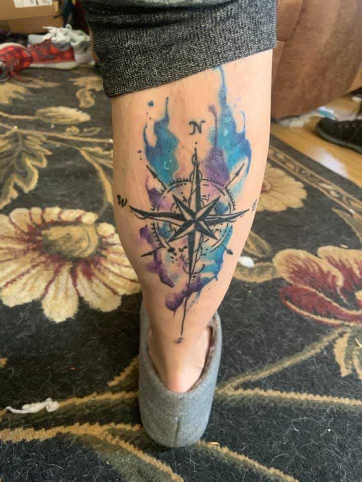 color and compass on back of calf tattoo