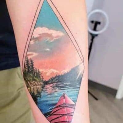 cropped-color-kayaking-in-nature-tattoo-forearm.jpg