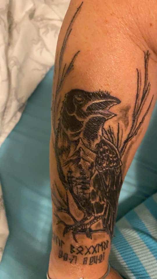 skeltal black and white raven tattoo