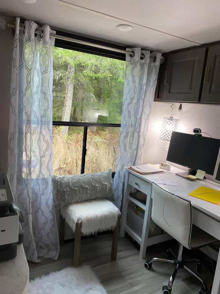 pretty modern home office in camper with window