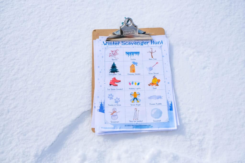 scavenger hunt on clipboard on snow
