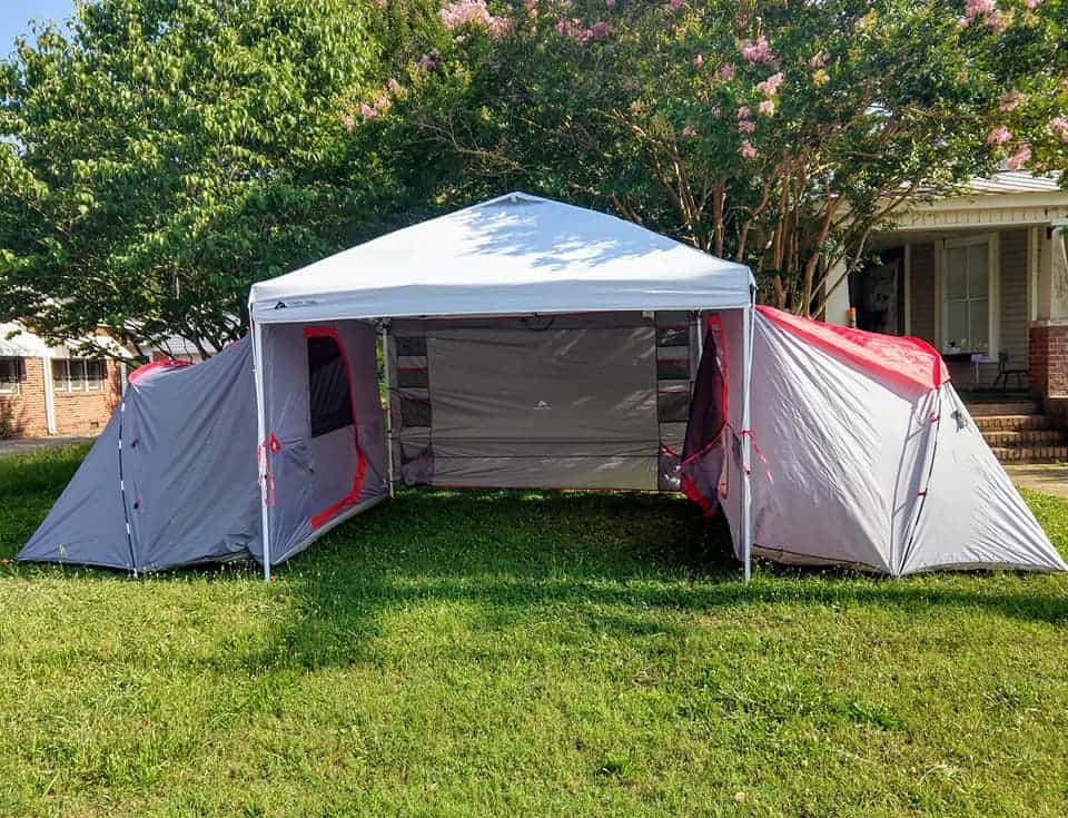 dual tent and shaded common area camping setup 