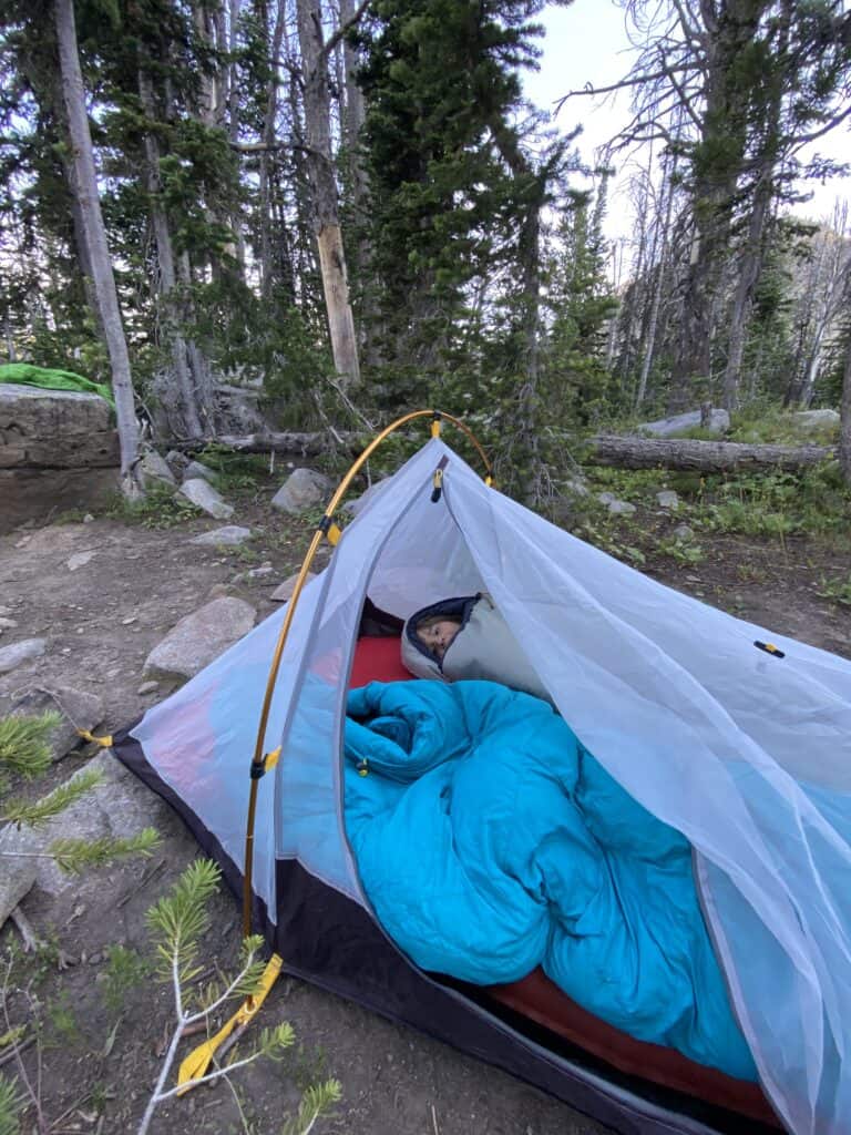 child sleeping in backpacking style tent