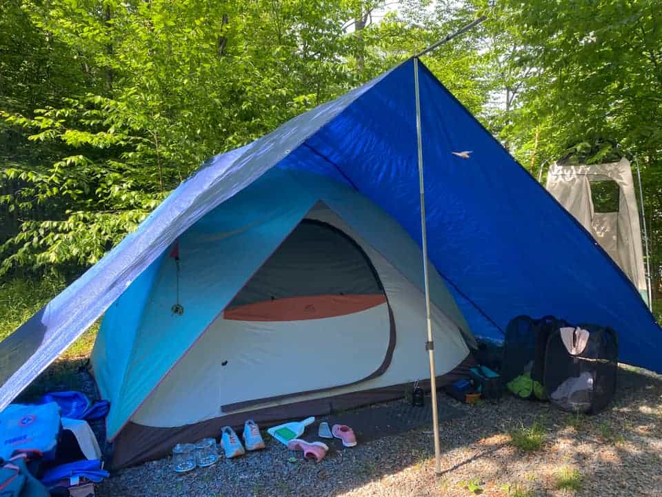 tarped mud room area in tent camping layout