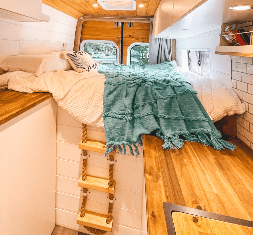 loft bedroom van layout with cute rope ladder and wood aesthetic
