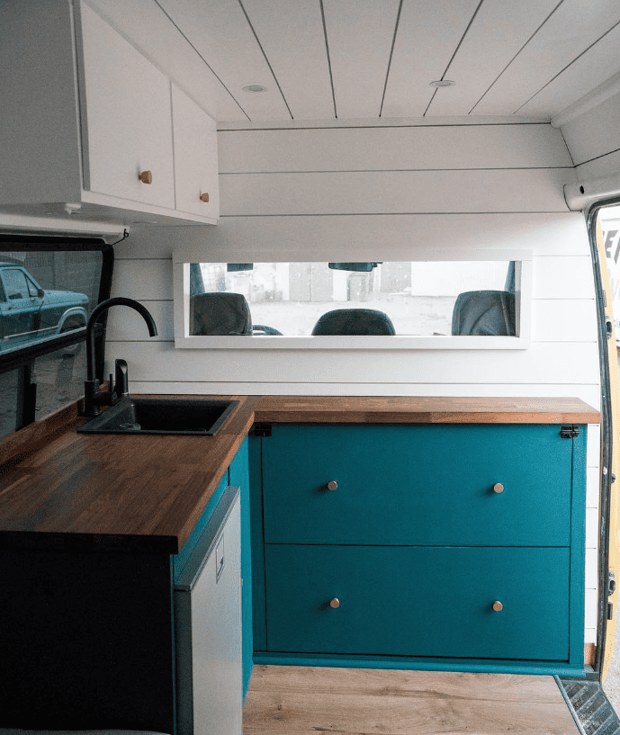 corner teal van kitchen and private drivers area