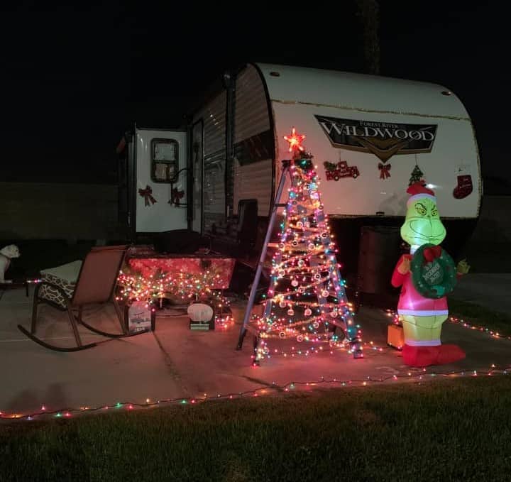 diy a frame ladder christmas light tree in front of camper with grinch inflatable