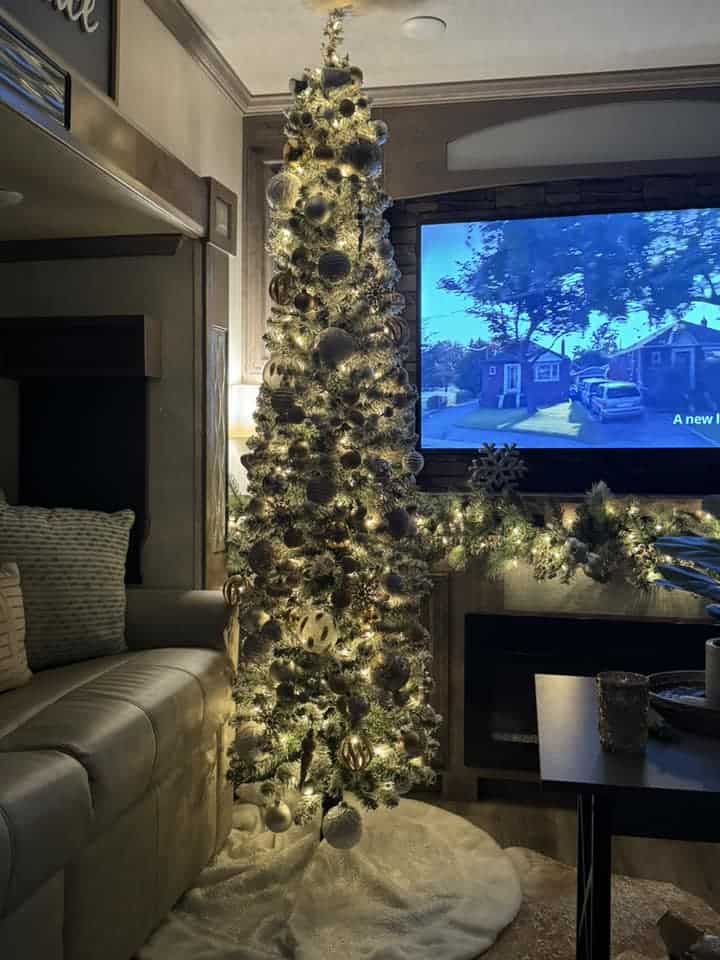 farmhouse aesthetic in rv for holidays skinny tree with white ornaments and lights