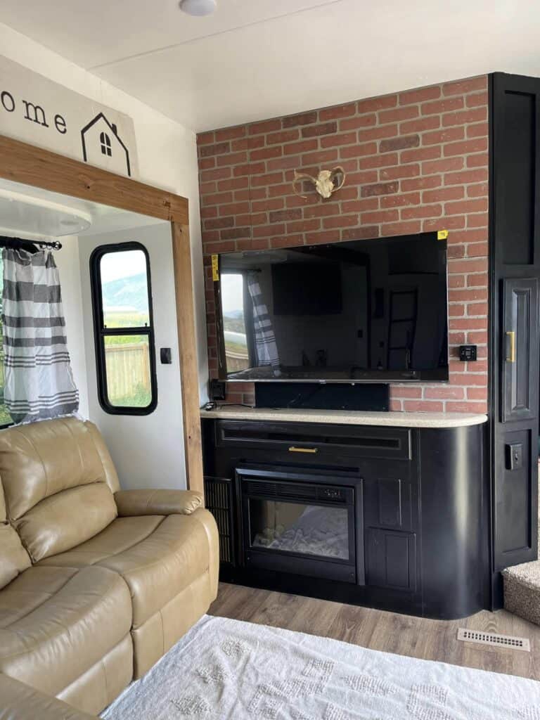 brick accent wall in front of camper fireplace