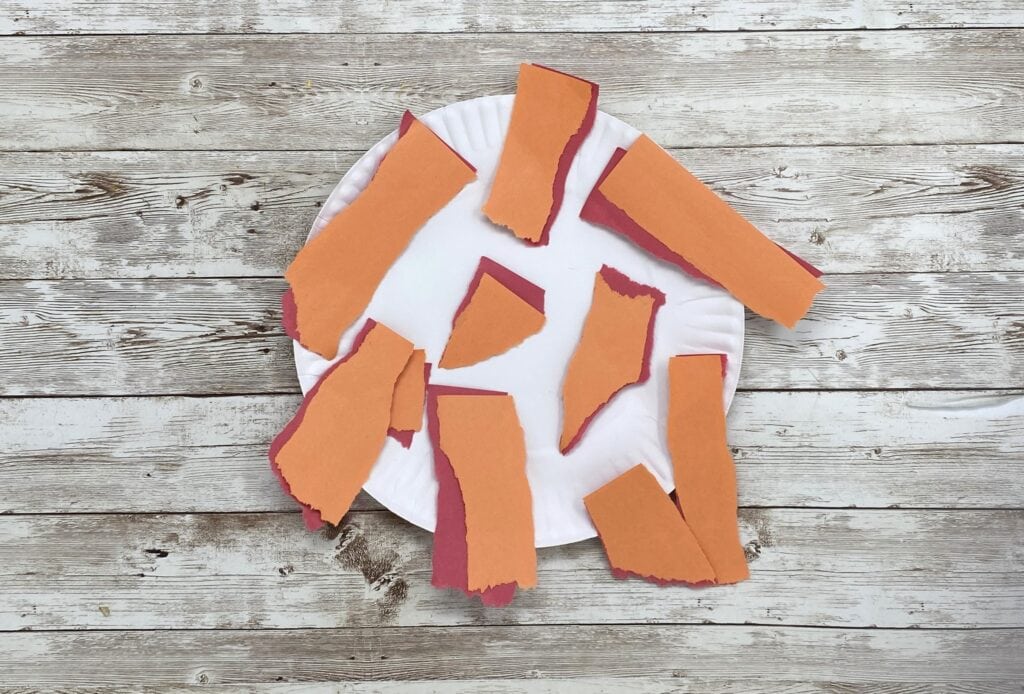ripped up construction paper for campfire