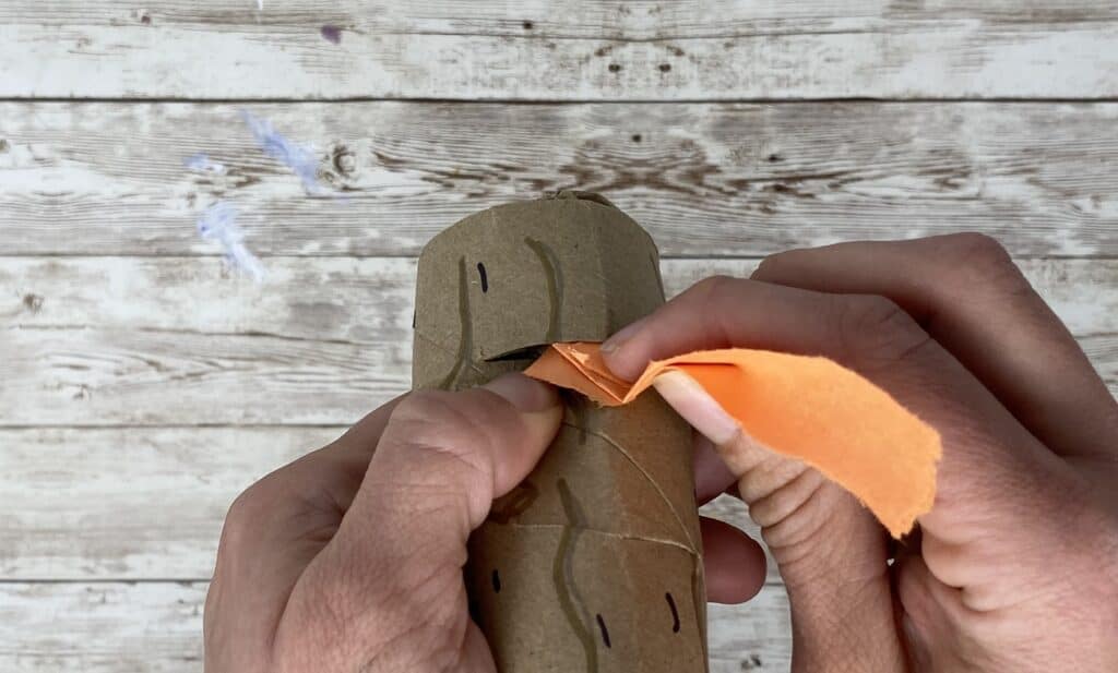 use slits in logs to slide in paper flames