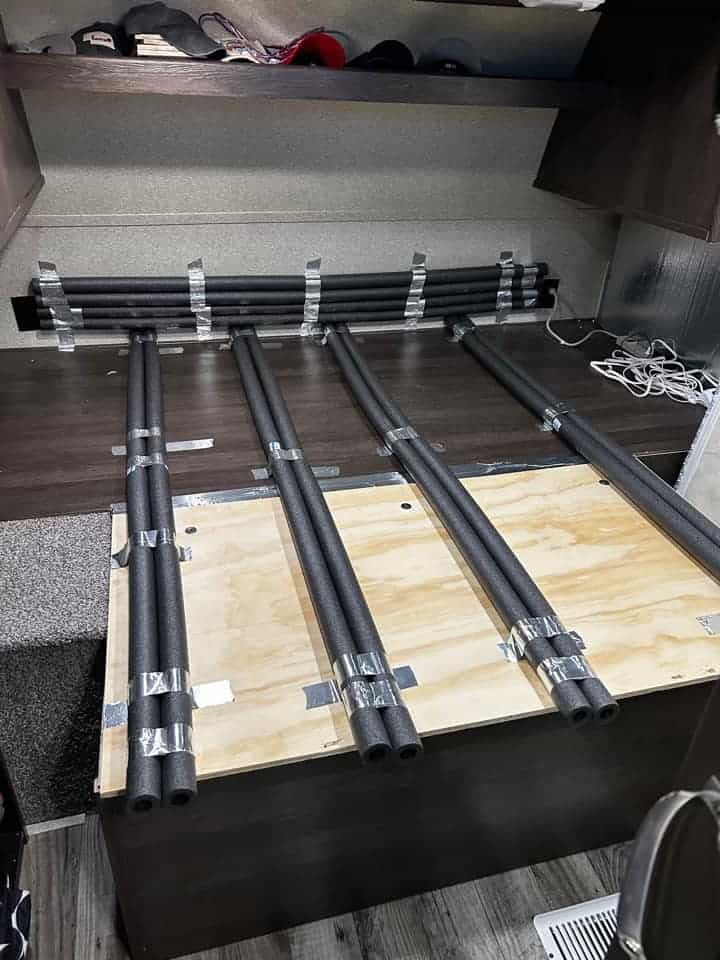 pool noodle foam tubes taped to rv bed platform to prevent mold and increase airflow