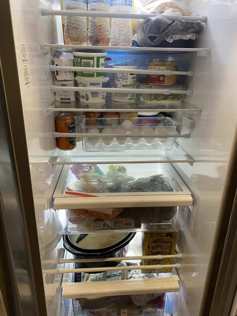 rv fridge with tension bars to stop things from falling out