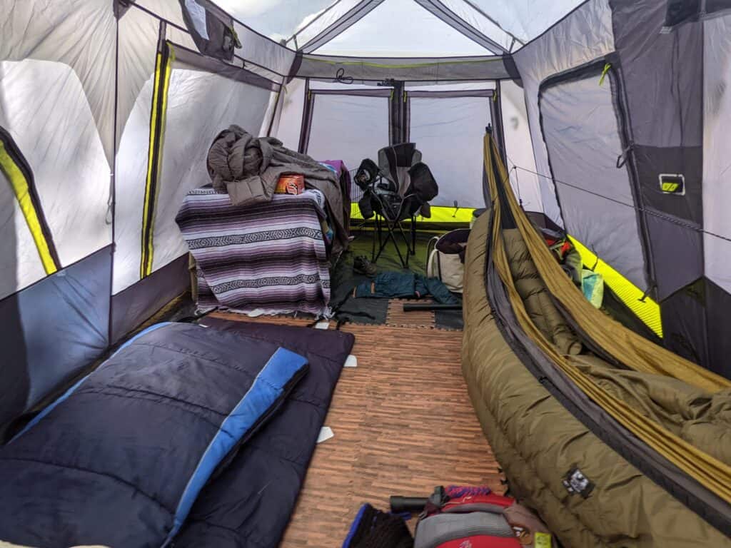 hammock camping inside of a tent