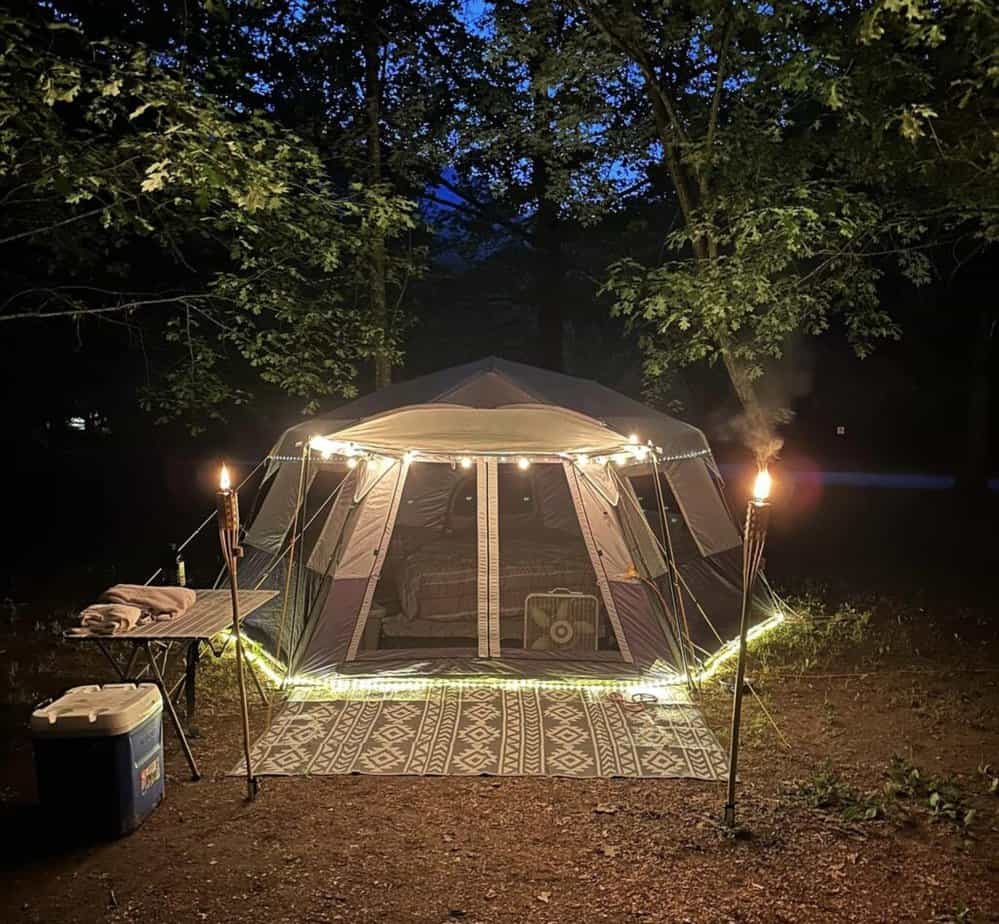 tent campsite with tiki torches