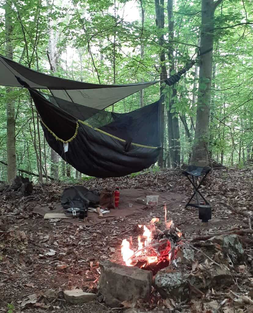 hammock camping set up with bug net and underquilt