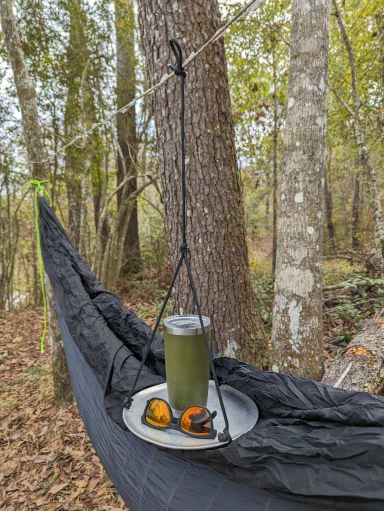 table hanging near hammock in woods