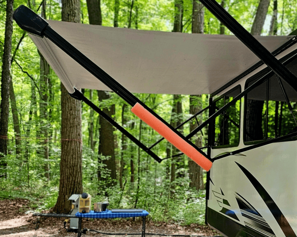 pool noodle from dollar general being used for rv awning arm